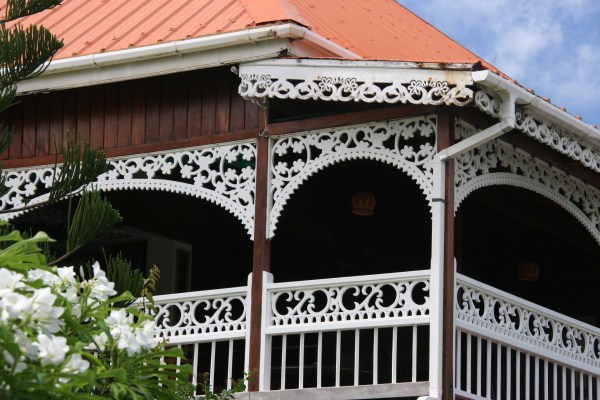 The Frangipani Hotel with its beautiful Gingerbread style of architecture. 